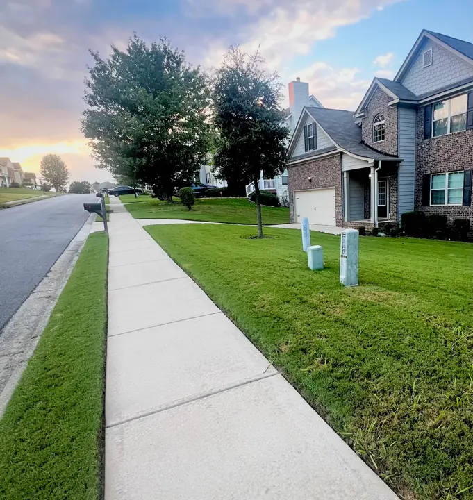 Long residential sidewalk looking bright and even after pressure washing.